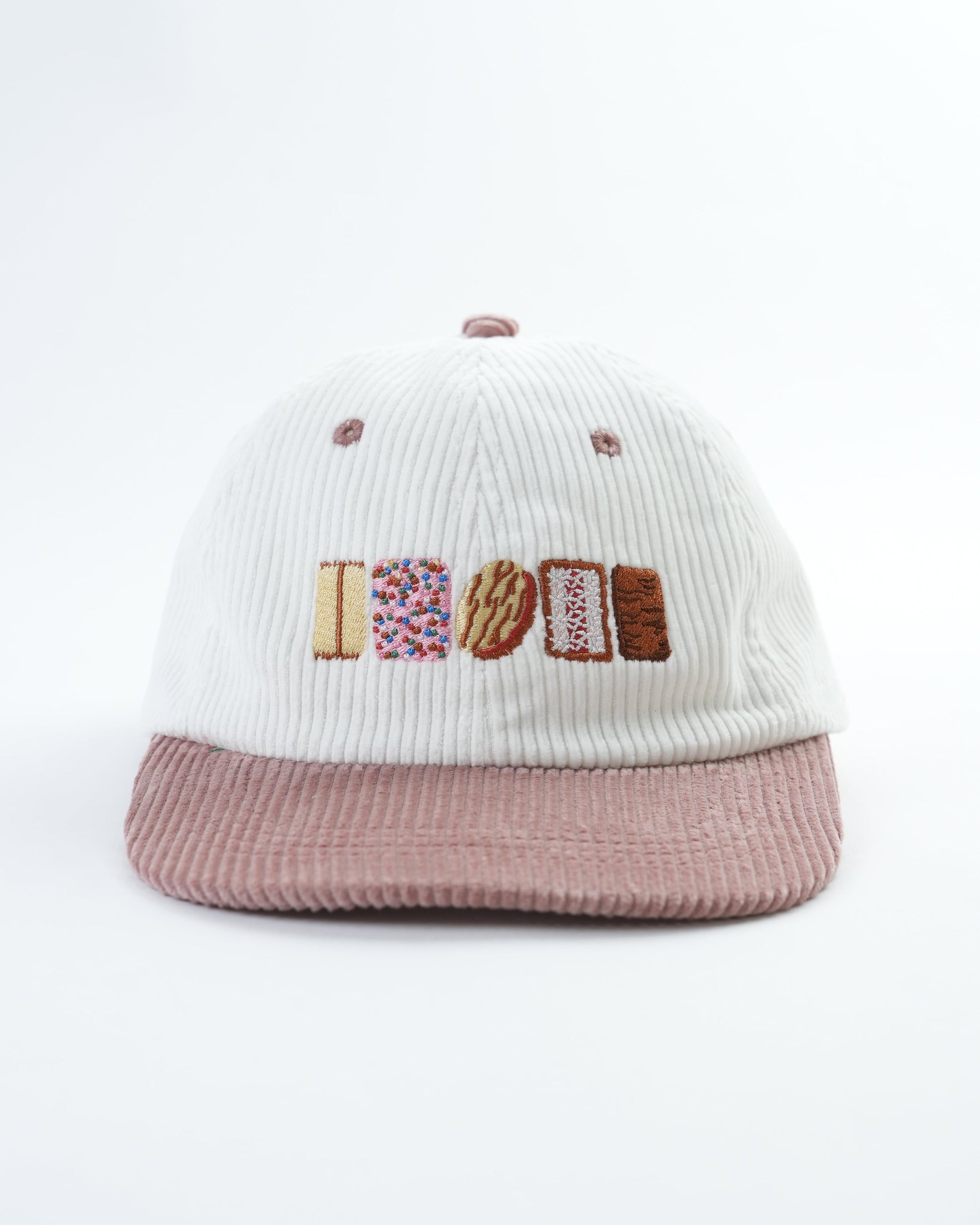 Knit cap with ribbed crown, colorful 'AUSSIE' logo patch, mauve brim