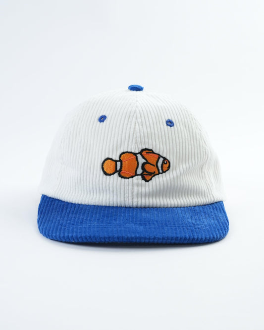 White and blue baseball cap with clownfish patch and blue embroidered dots