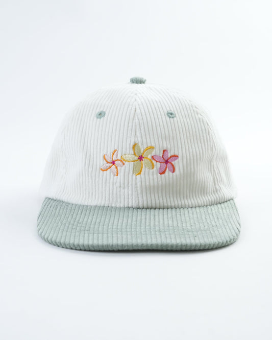 White ribbed bucket hat with light teal brim and embroidered flower logo