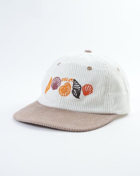 White ribbed baseball cap with beige brim and colorful seashell applique front