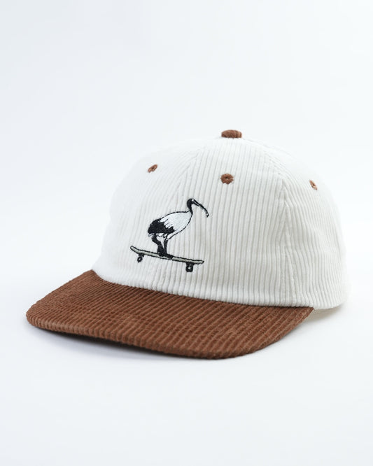 Skatepark scavenger hat with white knit crown, brown brim, skateboarder patch front