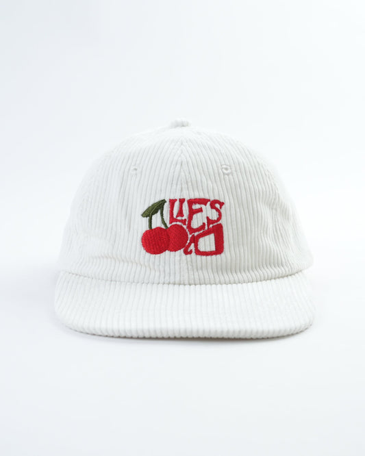 White ribbed baseball cap with cherry patch logo