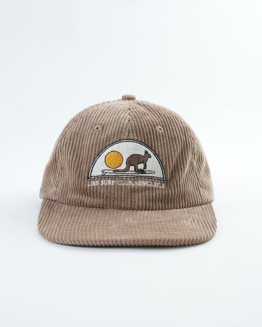 Tan corduroy baseball cap with front embroidered patch and curved brim