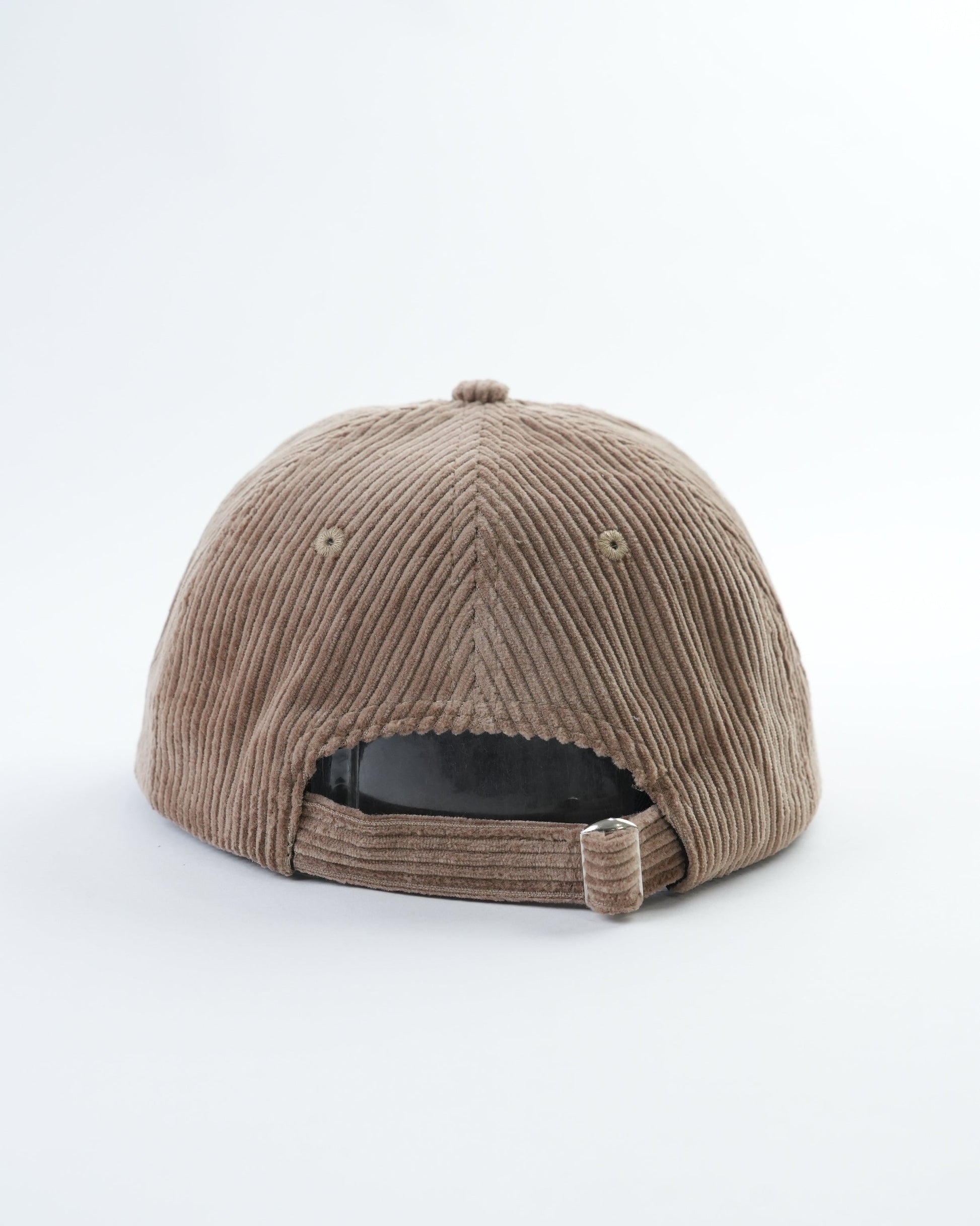 Tan corduroy baseball cap with adjustable strap and back seam