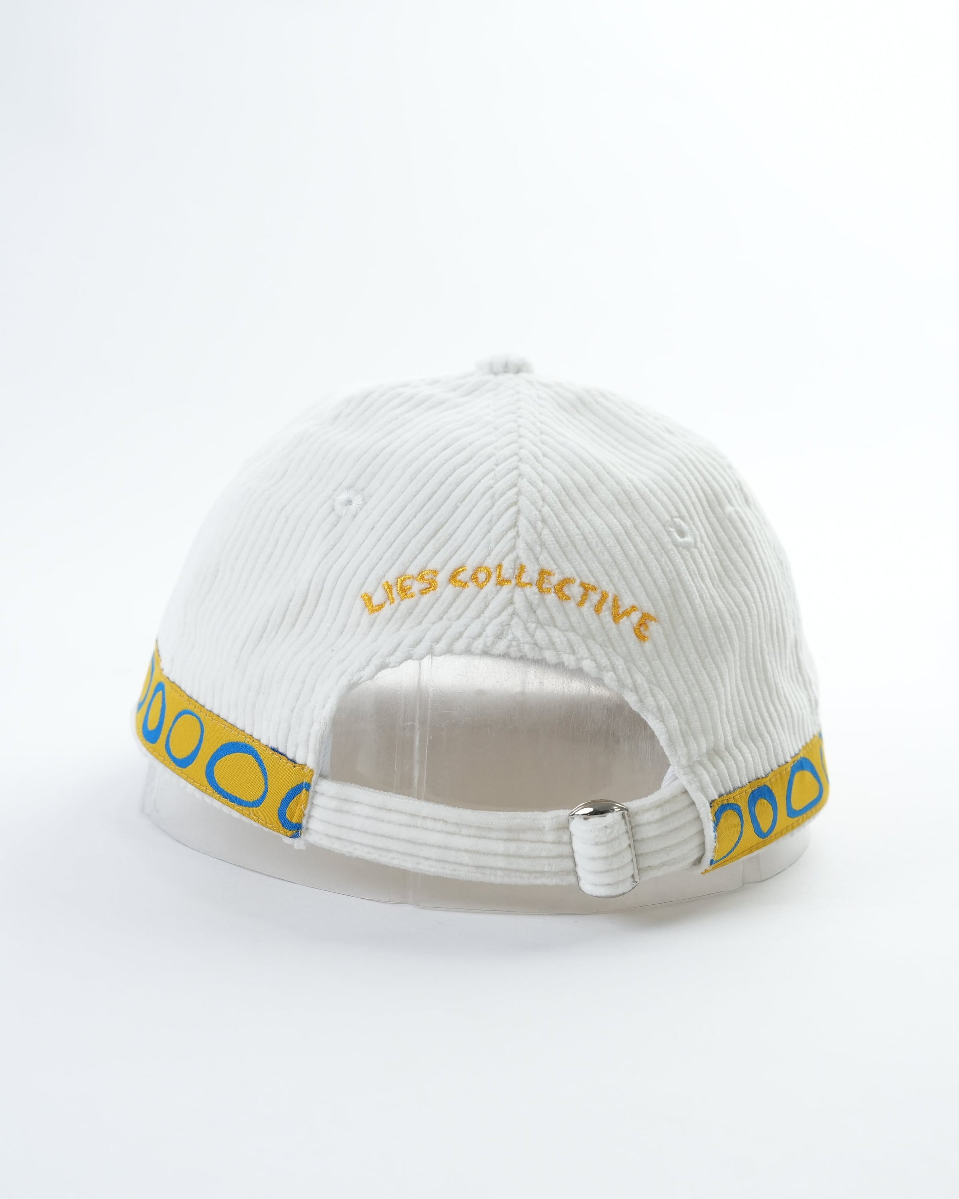 White ribbed cap with “YES COLLECTION” wordmark and blue side trim