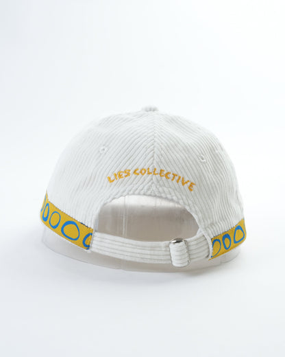White ribbed cap with “YES COLLECTION” wordmark and blue side trim