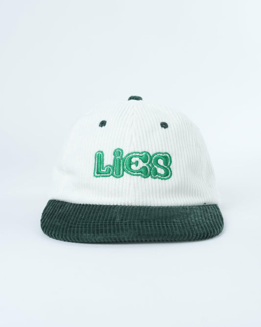 White ribbed baseball cap with dark green brim and green Lies logo center