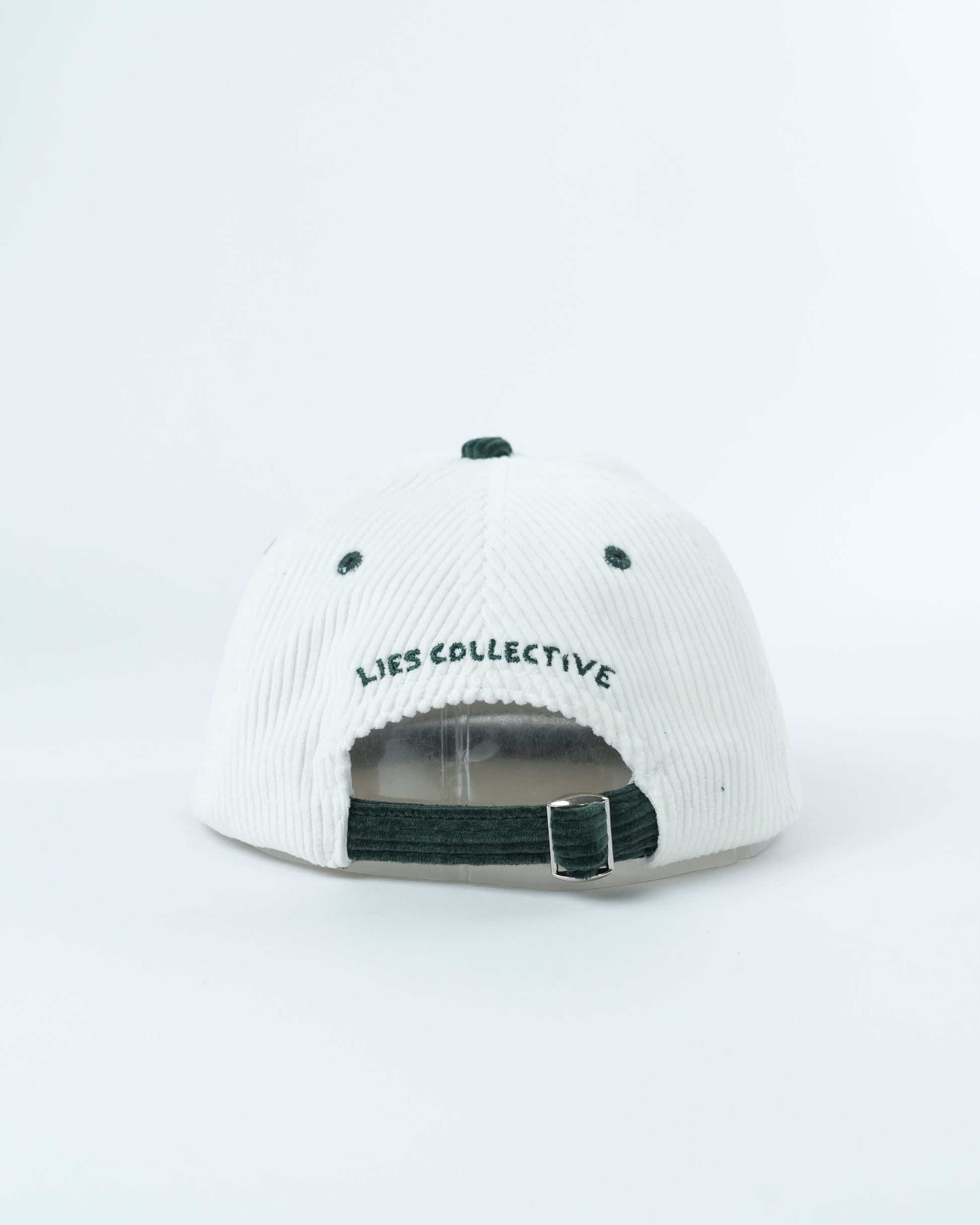 White ribbed cap with dark green strap and 'Lies Collective' back logo