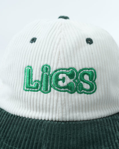White ribbed cap with dark green brim and large green Lies logo back