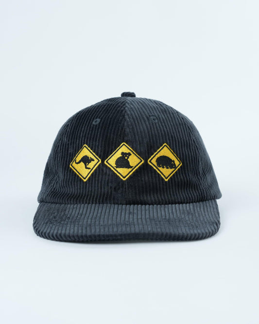 Dark gray corduroy baseball cap with three yellow wildlife patches on front