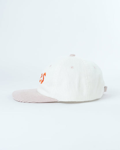 White ribbed knit cap with small orange side logo and light pink brim