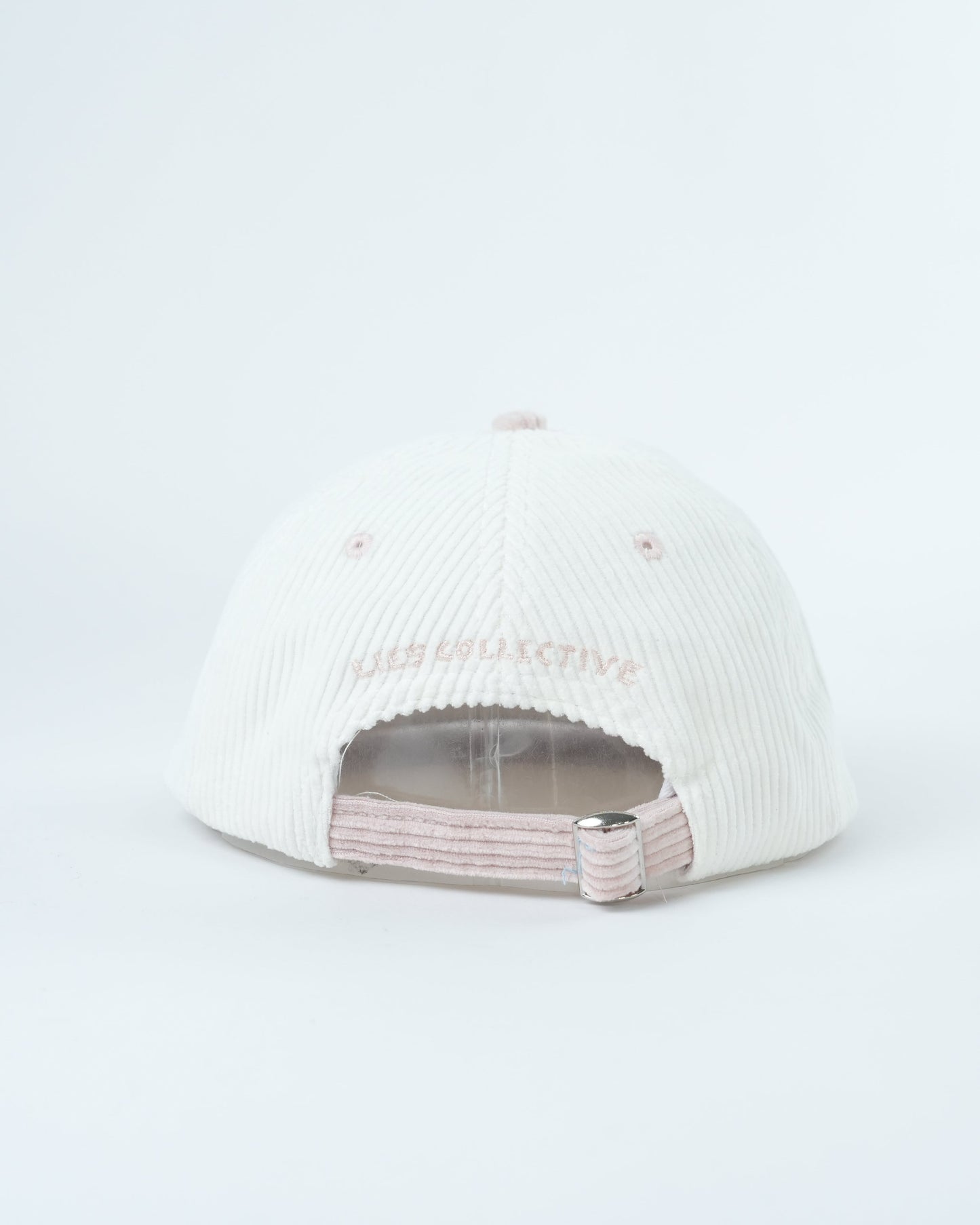 White ribbed knit cap with light pink underside and layered inner band