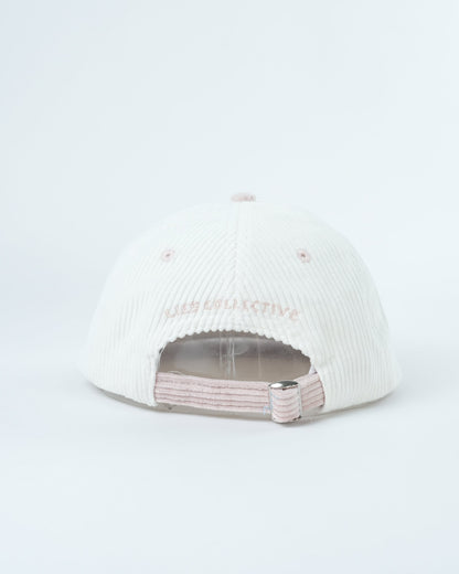White ribbed knit cap with light pink underside and layered inner band
