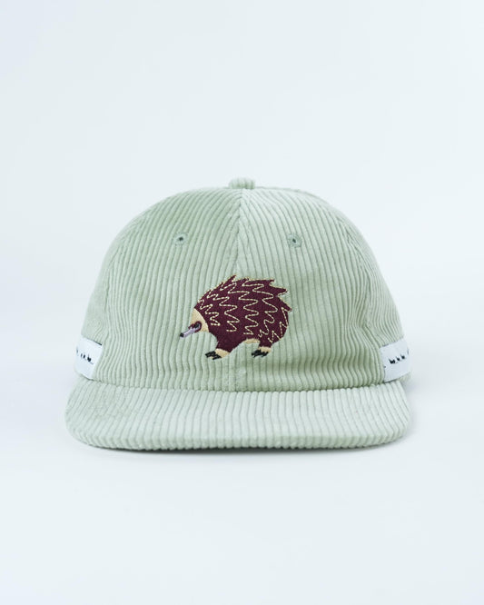 Mint green corduroy trail hat with echidna patch on front