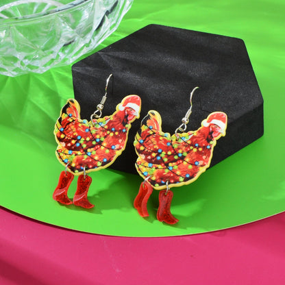 Pair of Santa acrylic dangle earrings with multicolor light pattern and red boots
