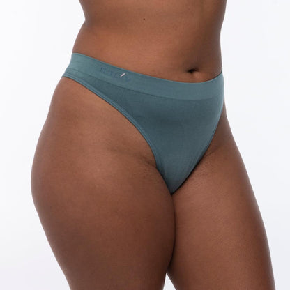 Blue cheeky G-string underwear, close-up of back waistband and high-cut leg