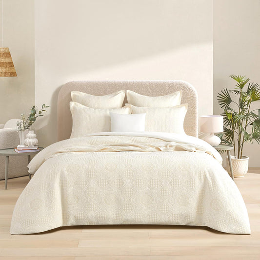 Beige jacquard king quilt cover set with matching pillowcases, subtle swirl pattern