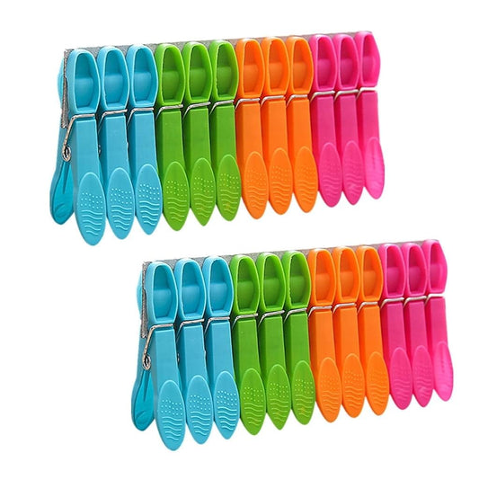 Colorful plastic clothespins with spring clips, multicolor set in rows