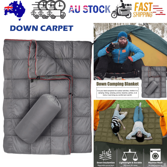 Packable down camping blanket, gray with red piping and foldable carry roll pocket