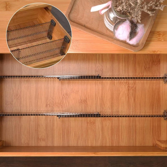 Drawer divider grid installed in a wooden drawer, clear black plastic with slots