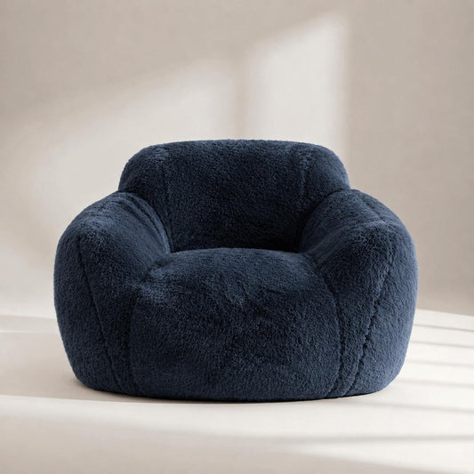 Charcoal gray plush bean bag chair with rounded back and armrests