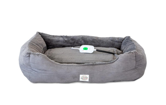 Heated faux-fur pet bed in gray with white controller on top