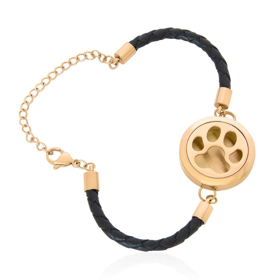 Gold-tone paw locket essential oil bracelet with braided black cord and chain links
