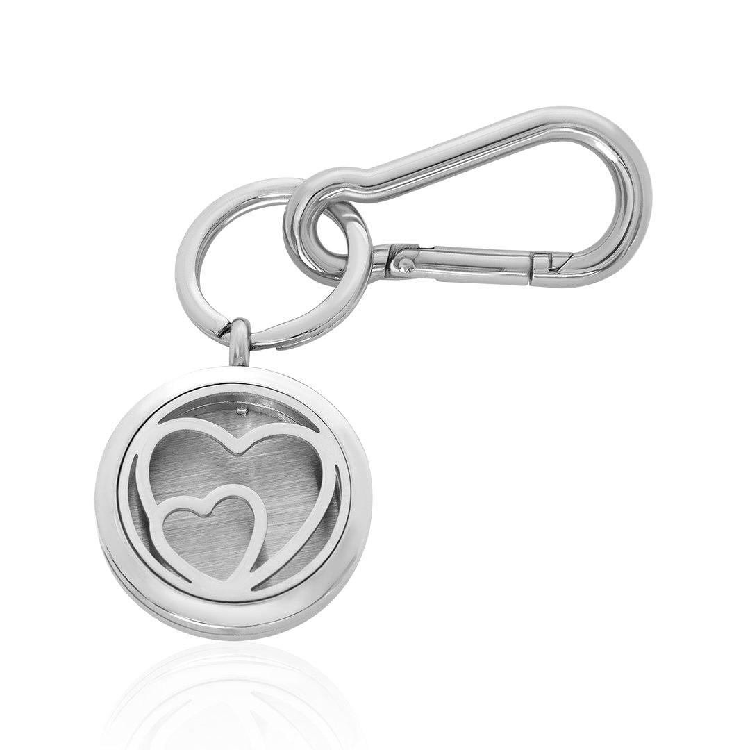 Silver-tone heart locket keychain with circular heart cutout and clasp