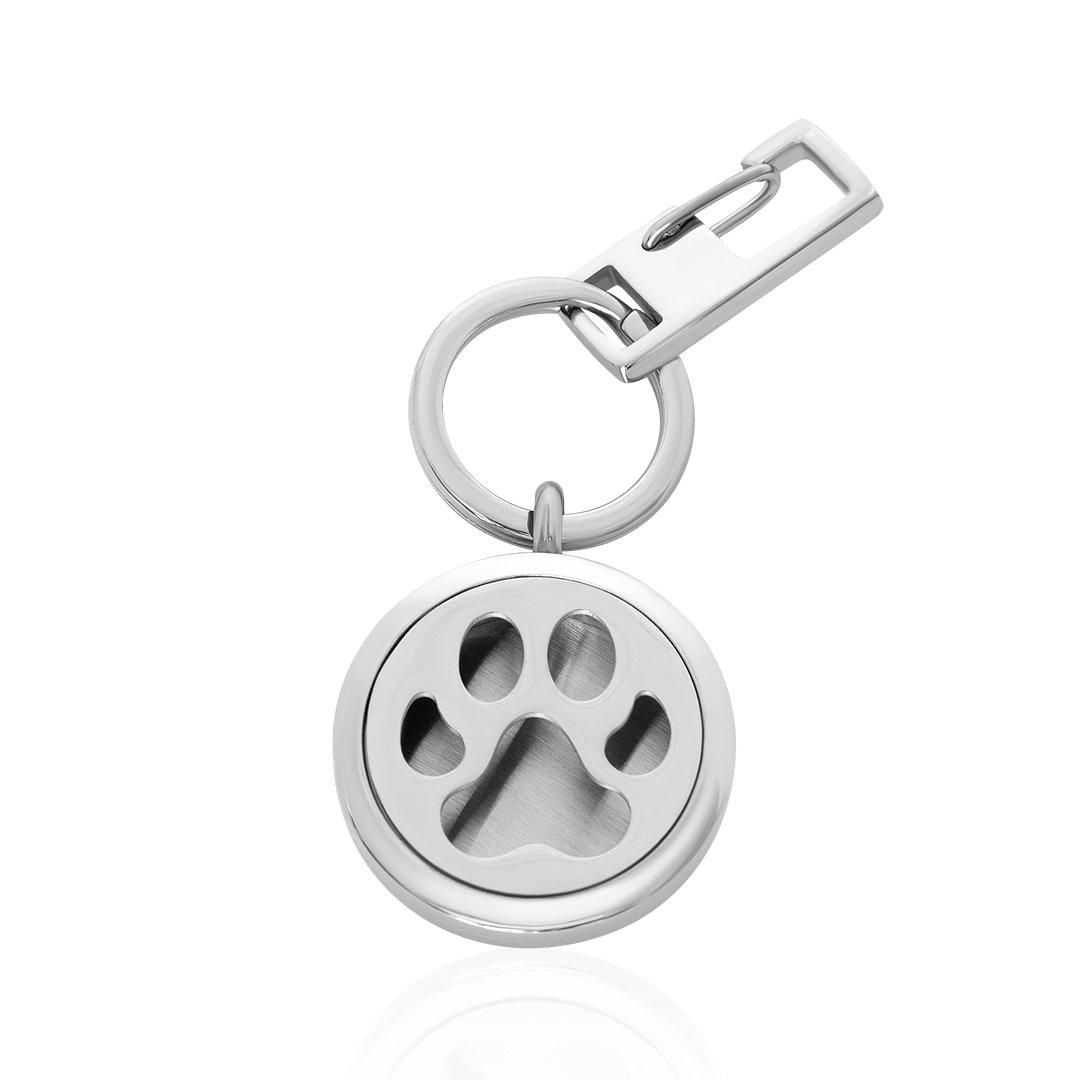 Paw-shaped metal key chain with round silver charm and clasp