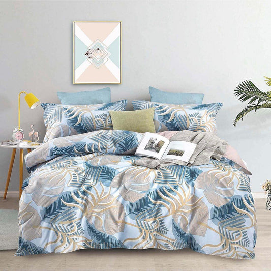 Super king quilt and duvet cover set with blue leaf pattern and matching pillows