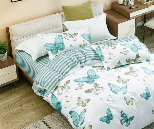 Super king butterfly quilt and duvet set on bed, teal striped accent and butterfly print