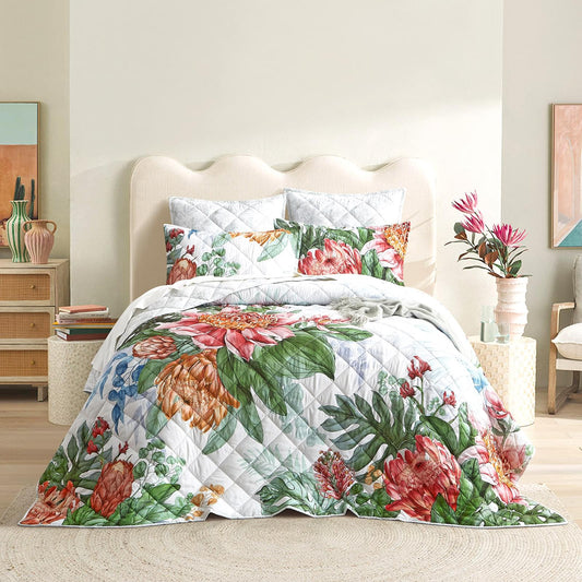Quilted reversible coverlet set with white base and colorful floral print