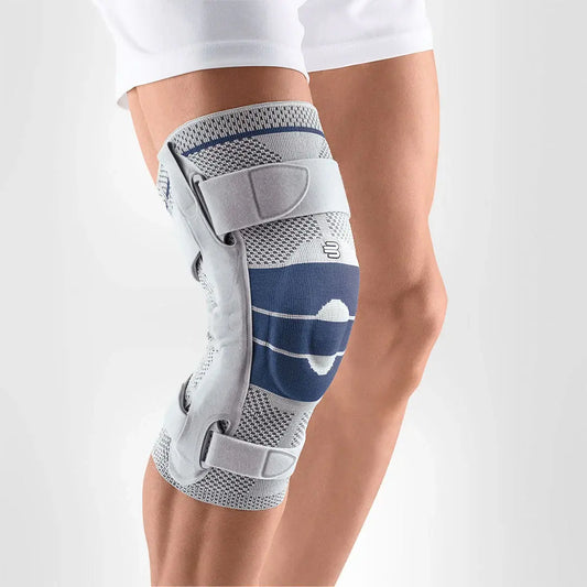 Hinged knee brace with blue stripes and gray knit fabric, worn on a knee.