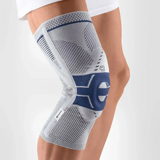 Knee support brace in gray knit with blue trim and hinged stabilizer, worn on leg