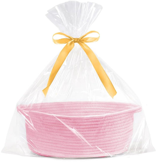 Pink woven rope storage basket in clear gift bag with yellow ribbon and bow