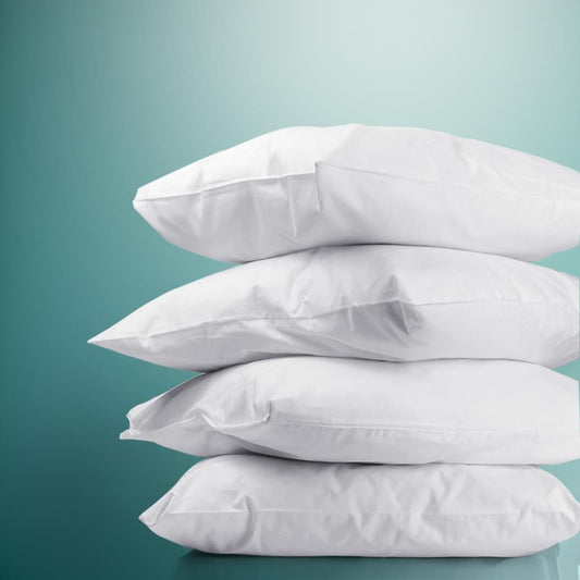 Stack of white bed pillows with soft, light loft