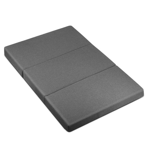 Grey foldable foam mattress with fold seam and rounded corners