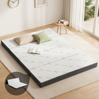 Foldable queen foam mattress with white bamboo-pattern cover and dark gray edges