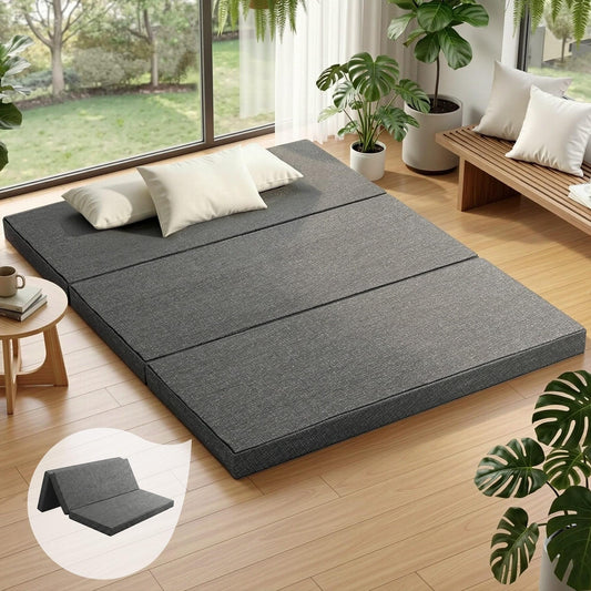 Foldable grey queen foam mattress with three sections, flat on the floor
