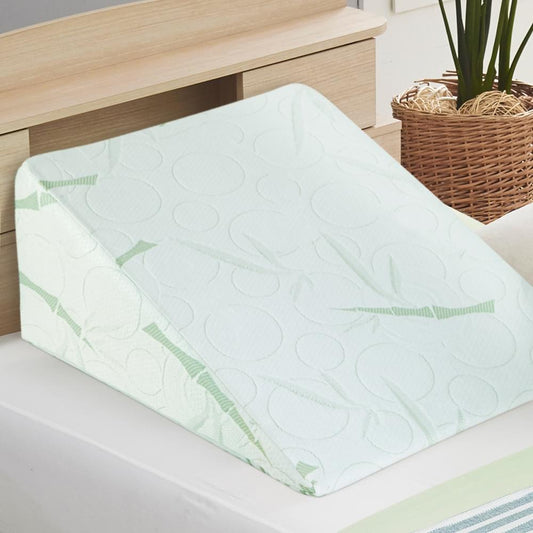Twin wedge pillow with white bamboo cover and green leaf pattern, angled support design