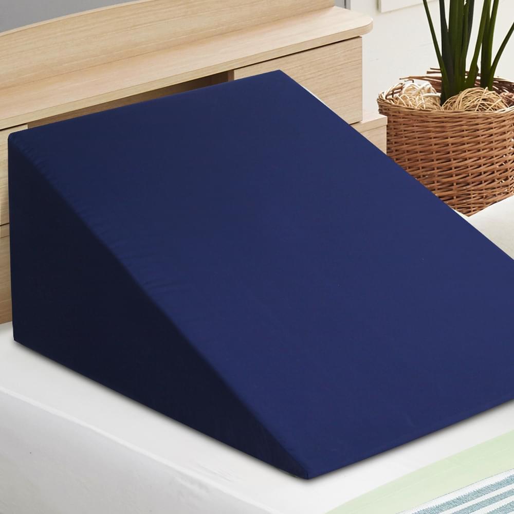 Blue wedge pillow for sleeping, smooth fabric surface and corner edge visible