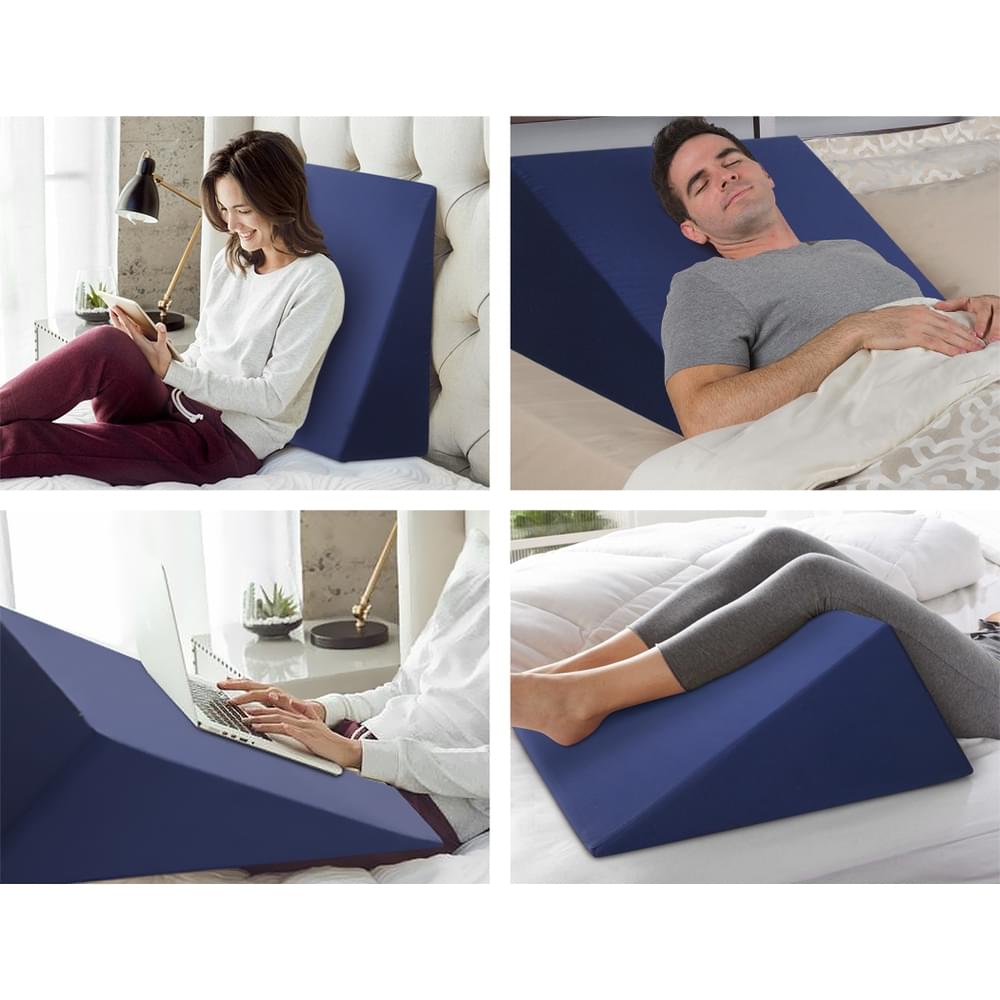 Blue wedge pillow in use, supporting head and upper body while sleeping