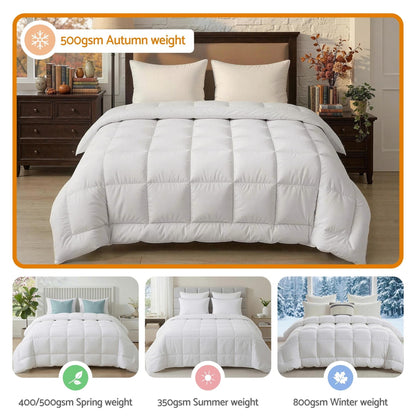 White wool quilt with box baffle design, displayed on a bed with two pillows