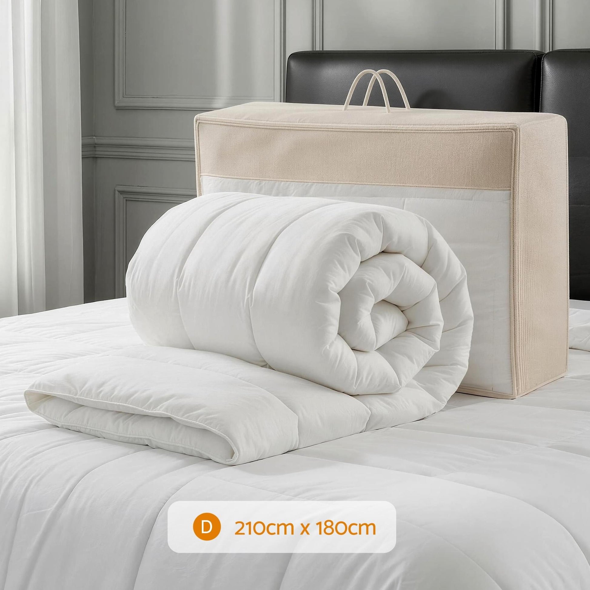 Giselle wool quilt doona, rolled white duvet with box-stitched baffles