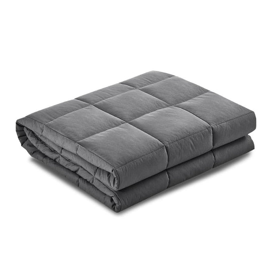 Dark gray quilted weighted blanket, neatly folded into stacked layers