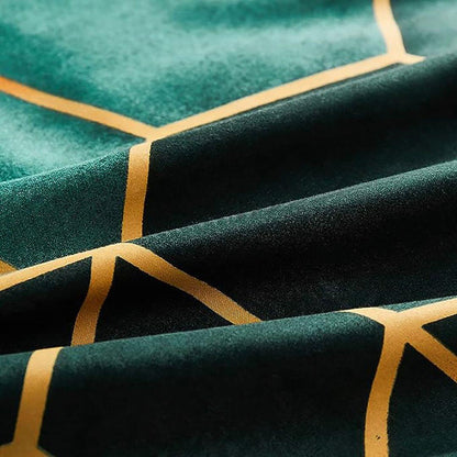 Quilt fabric close-up with dark green base, teal overlay, yellow geometric stripes