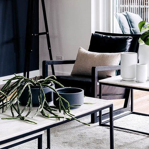 Round plant pot set with dark and light gray pots on a outdoor table