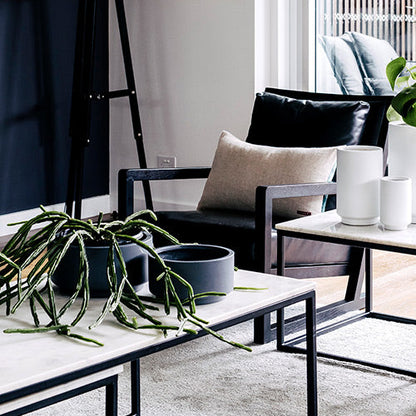 Round plant pot set with dark and light gray pots on a outdoor table