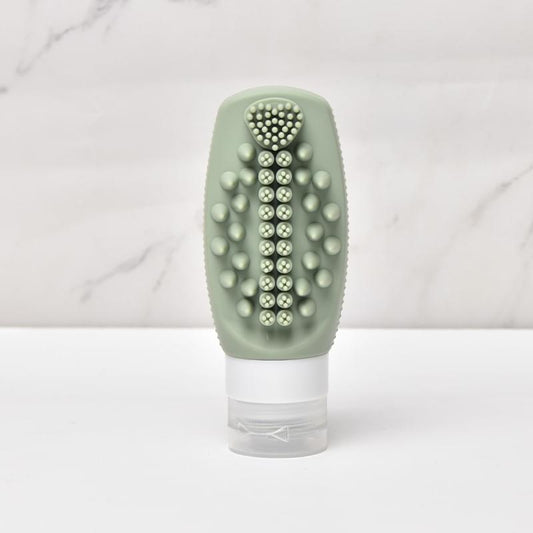 Sage green silicone massage brush refill squeeze bottle with rounded spiked head