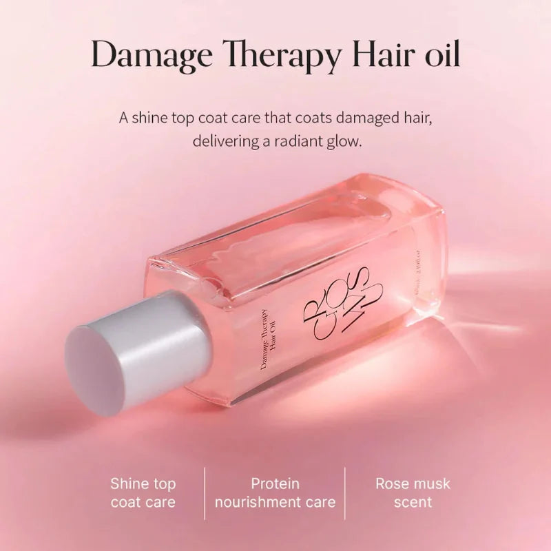 Hair oil bottle with white cap removed, showing pink-tinted liquid